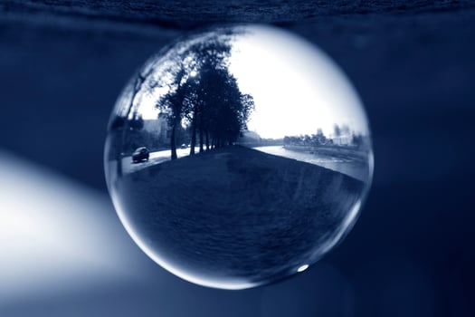 Landscape seen through the lens ball. photo