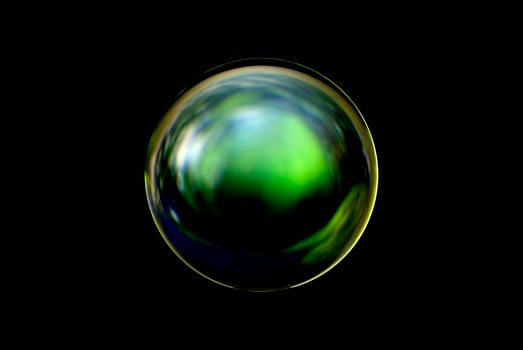 An abstract sphere with a blurry pattern isolated on black background. photo