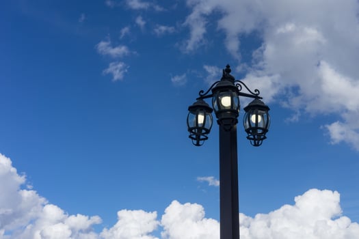 the lantern in the old style on the background of blue sky photo