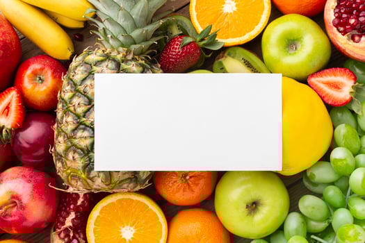 Blank card on top of fruit photo