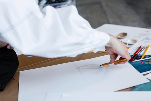 Person drawing on paper photo