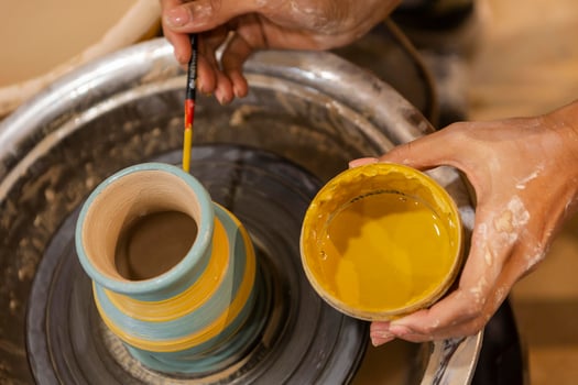 Top view of a person creating pottery photo