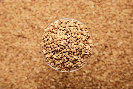 Raw buckwheat in focus and blur photo