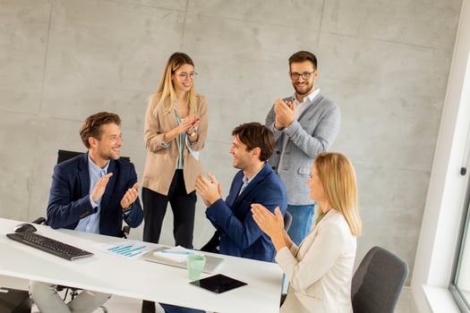 Group of business people clapping photo