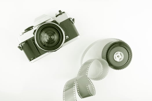 Vintage film camera with a roll of film photo