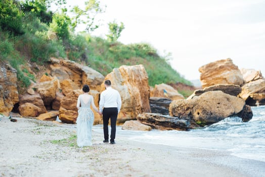 Same couple with a bride in a blue dress walk photo