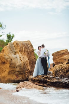 Same couple with a bride in a blue dress walk photo