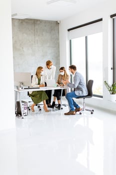 Masked professionals with copy space photo