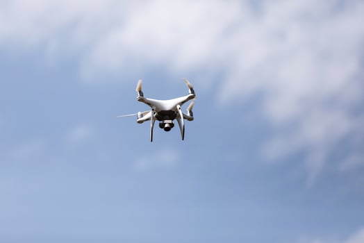 Quadcopter drone in sky photo