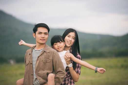Dad and two daughters outside on a walk photo
