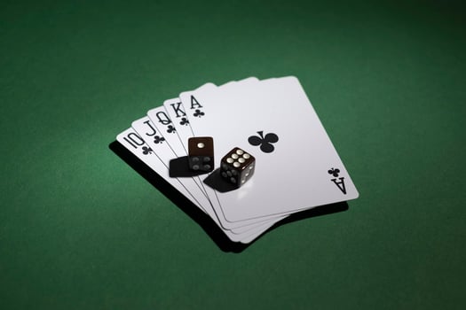 Royal flush cards with dice on green background photo