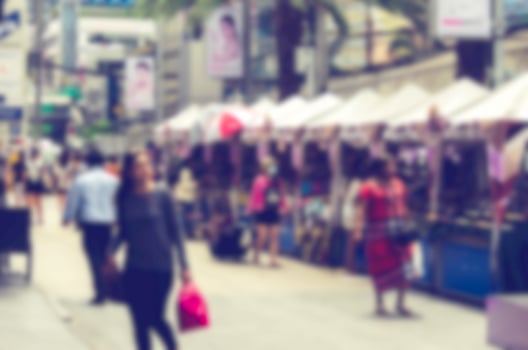 Blurred people walking the streets. Vintage style photo