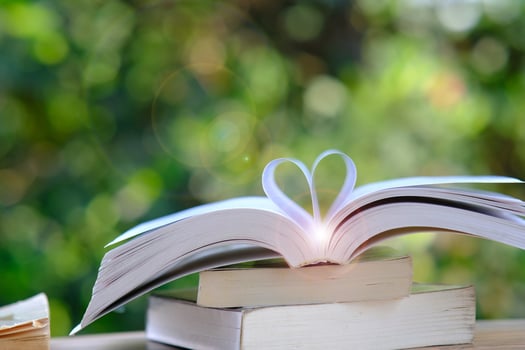 Book on green bokeh background and education learning concept photo