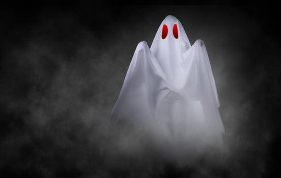 White ghost on black background photo