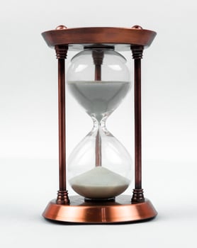 Sand clock concept with hourglass photo
