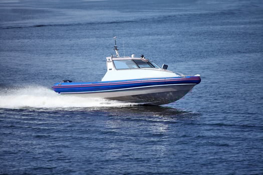 Speedboat cruising in the sea photo
