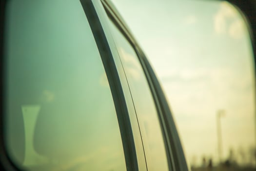 Sky reflected on the windows of a car photo
