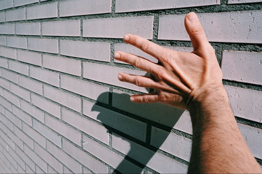 hand gesturing in the shadows photo