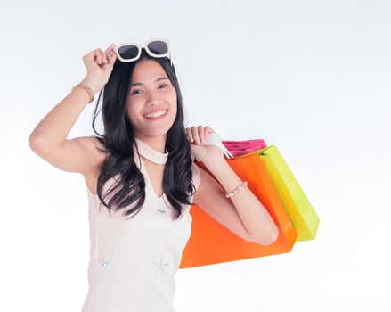 Asian woman carrying shopping bags with smiling faces on a white background photo