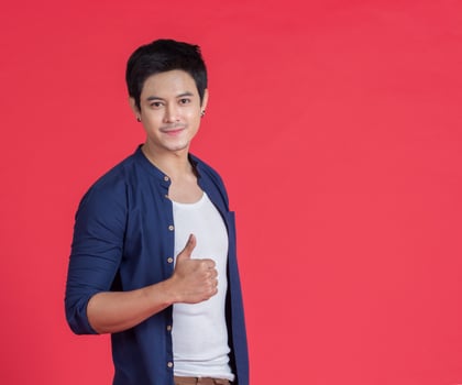 Portrait handsome man stand smiling on red background photo