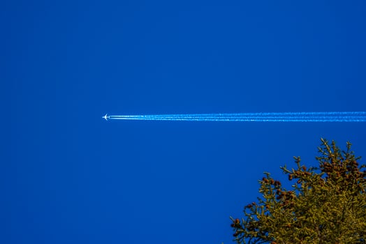 Airplane on blue sky photo