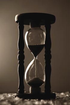 A  sand clock in black and white photo