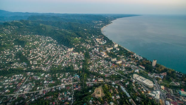 Landscape with night city of Sukhum Abkhazia photo
