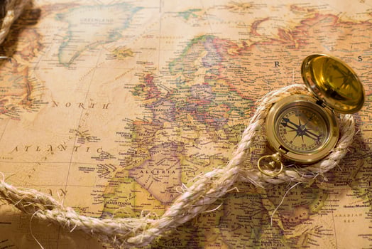 old compass and rope on vintage map photo