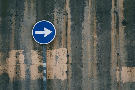 arrow traffic sign on the street photo