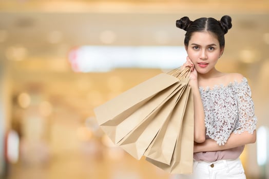Attractive shopper woman holding shopping bags photo
