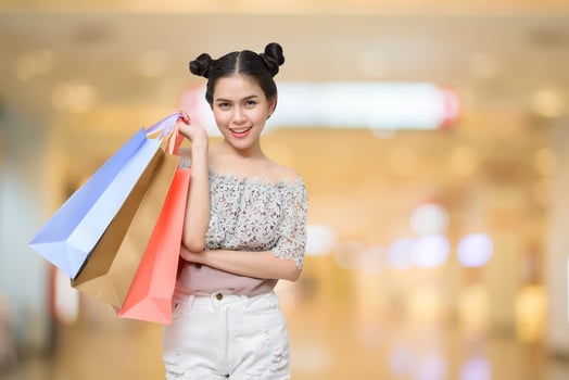 Attractive shopper woman holding shopping bags photo
