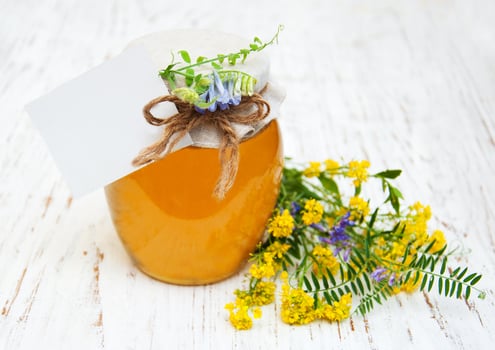 Honey and wild flowers photo