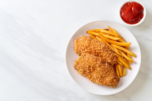 Fried chicken breast fillet steak with french fries and ketchup photo