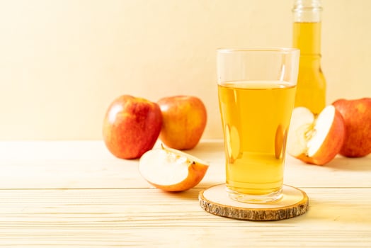 Apple juice with red apples fruits photo