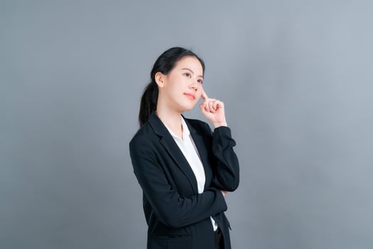 Beautiful and young Asian woman thinking photo