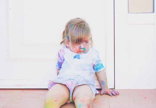 Little girl dirty of paint photo