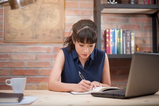 Beautiful woman is working in home office photo