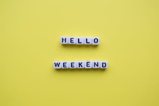 Hello weekend words on yellow background. photo