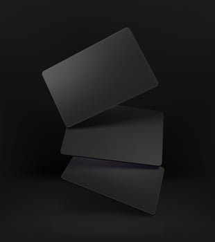Realistic black cards on black background vector