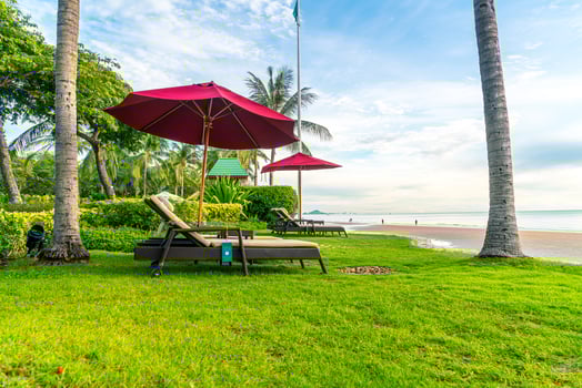 Umbrella with chair with sea beach background and sunrise in morning photo