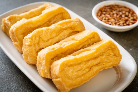 Fried tofu with sauce - vegan and vegetarian food style photo