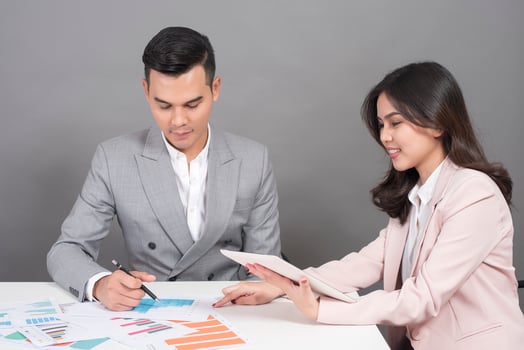 Businessman and businesswoman are analytic graph ,Business plan and business meeting concept photo