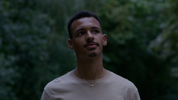 Young man standing in park photo