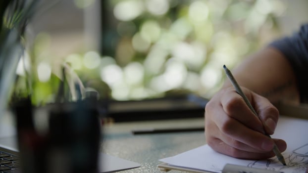 young man drawing picture photo