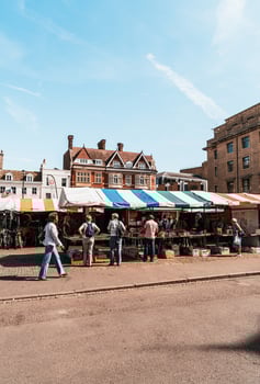 CAMBRIDGE UK - AUG 28, 2019  Market Square and Great St Mary's Church, Cambridge. photo