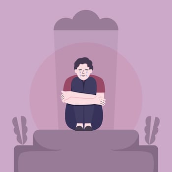 Young sad male sitting on the floor and holding his knees vector
