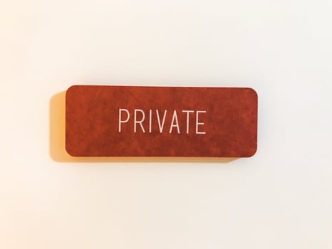 Orange sign on the white door. Private photo