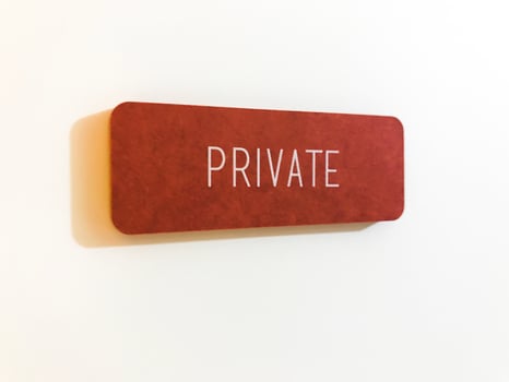 Orange sign on the white door. Private photo