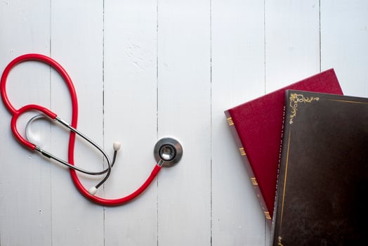 Concept of medical education with book and stethoscope photo