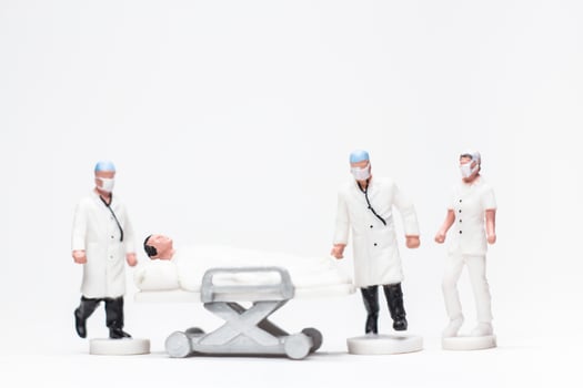 Simple Conceptual Photo, Mini figure doctors and nurses mini figure evacuation of infected patients photo